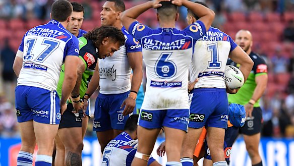 Josh Papalii  checks on Tuipulotu Katoa after the dangerous tackle.