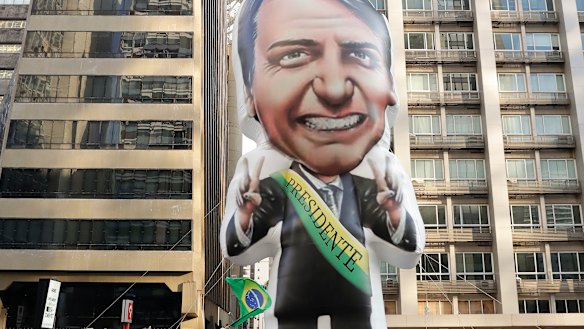 Supporters of Jair Bolsonaro, presidential candidate for the National Social Liberal Party who was stabbed during a campaign event, exhibit an inflatable doll in his image in Sao Paulo, Brazil.