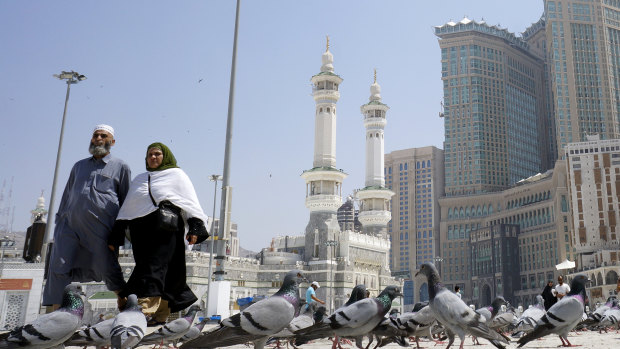 Muslim worshippers outside the Grand Mosque in the holy city of Mecca, Saudi Arabia. The kingdom has taken unprecedented measures against the spread of coronavirus, including halting pilgrimage in Mecca.