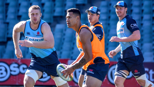 High visibility: Israel Folau looks to pass during training ahead of the Waratahs v Brumbies clash.