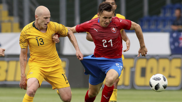 Australia's Aaron Mooy (left) and Sural (right) challenge for the ball during a friendly in June, 2018.