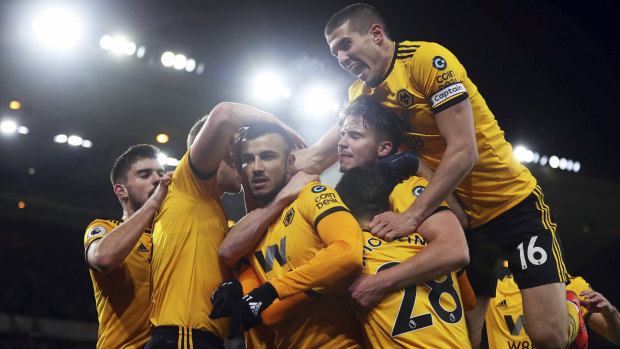Wolverhampton celebrates Romain Saiss kicking the opening goal against West Ham.