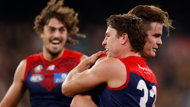 Bayley Fritsch celebrates a goal with Tom Sparrow and Luke Jackson.