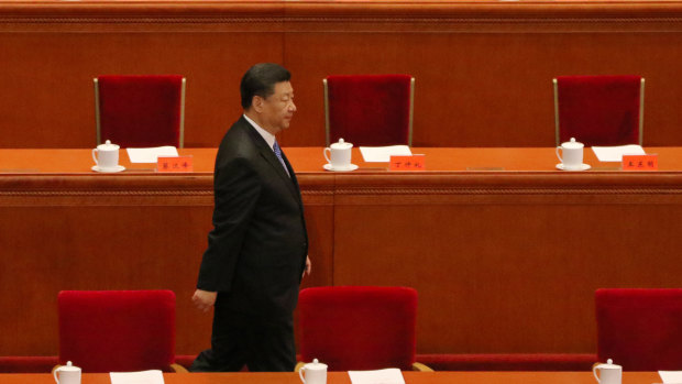Xi Jinping arrives at the podium to speak of the relevance of Marxism in modern China.
