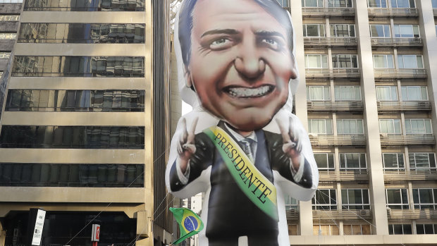 Supporters of Jair Bolsonaro, presidential candidate for the National Social Liberal Party who was stabbed during a campaign event, exhibit an inflatable doll in his image in Sao Paulo, Brazil.