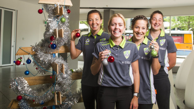 Canberra United players Rachel Corsie, Denise O'Sullivan, Paige Nielsen and Melissa Maizels at the Salvation Army toy drive on Tuesday. 