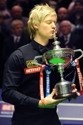 Top of the table: Neil Robertson kisses his trophy after winning the final of the World Snooker Championship in 2010. 