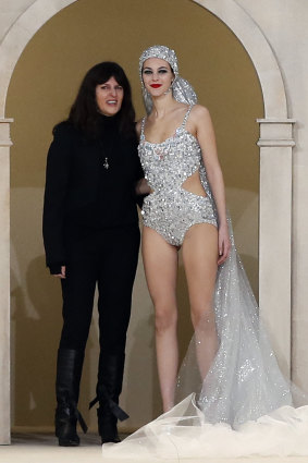 Virginie Viard, left, poses with a model during the Chanel Spring/Summer 2019 Haute Couture fashion collection presented in Paris, Tuesday January 22, 2019.