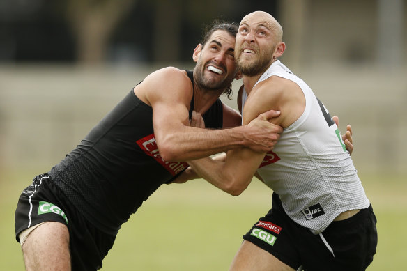 Brodie Grundy with teammate Ben Reid at Collingwood training.