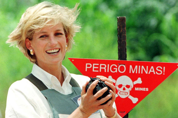 Diana, Princess of Wales, holds a landmine during visit to Haumbo minefields in Angola on behalf of the Red Cross in 1997.