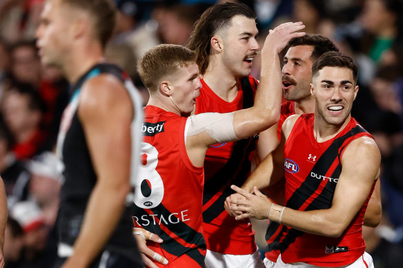 Ben Hobbs, Sam Draper, Kyle Langford and Jade Gresham of the Bombers celebrate.