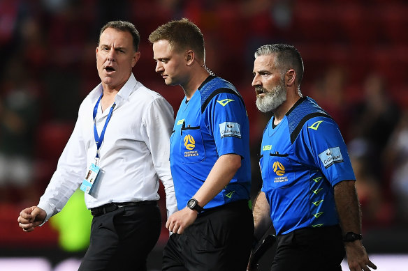 Mariners coach Alen Stajcic speaks with referee Adam Fielding after the full-time whistle on Friday.