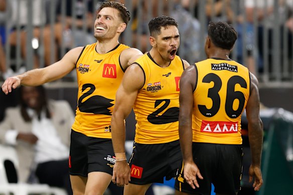 West Australians (from left) Stephen Coniglio, Charlie Cameron and Kysaiah Pickett enjoy a goal.