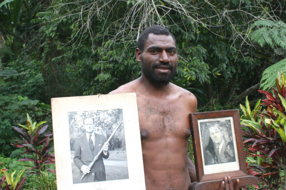  Tanna island resident Nathuan with photos of Prince Philip.