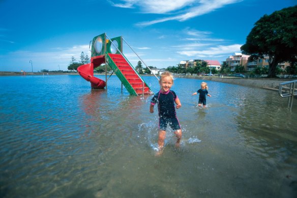 Kids cool off at Wynnum Wading Pool.