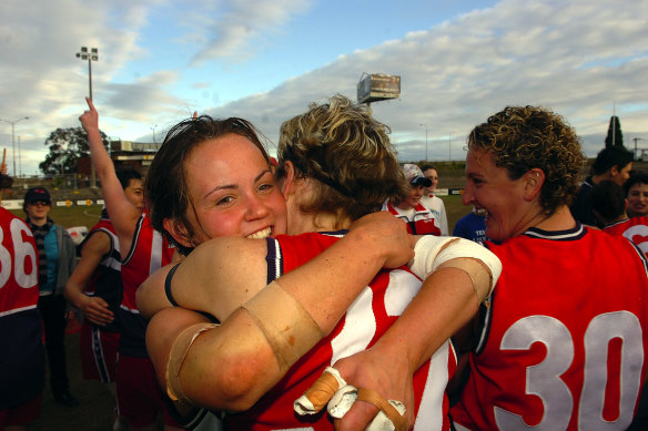 A young Daisy Pearce celebrates premiership success with her Darebin teammates in 2006.