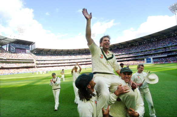 Australia’s Shane Warne is carried on the shoulders of teammates Andrew Symonds and Matthew Hayden in 2006 after his final Test match at the MCG.