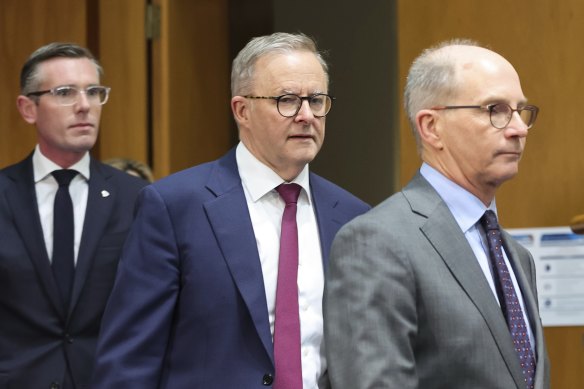 NSW Prime Minister Dominic Perrottet, Prime Minister Anthony Albanese and Chief Medical Officer Paul Kelly arrive for a press conference following Friday's national cabinet meeting.