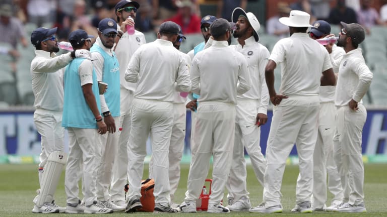 Upbeat: India enjoy a drinks break at Adelaide Oval on Friday.