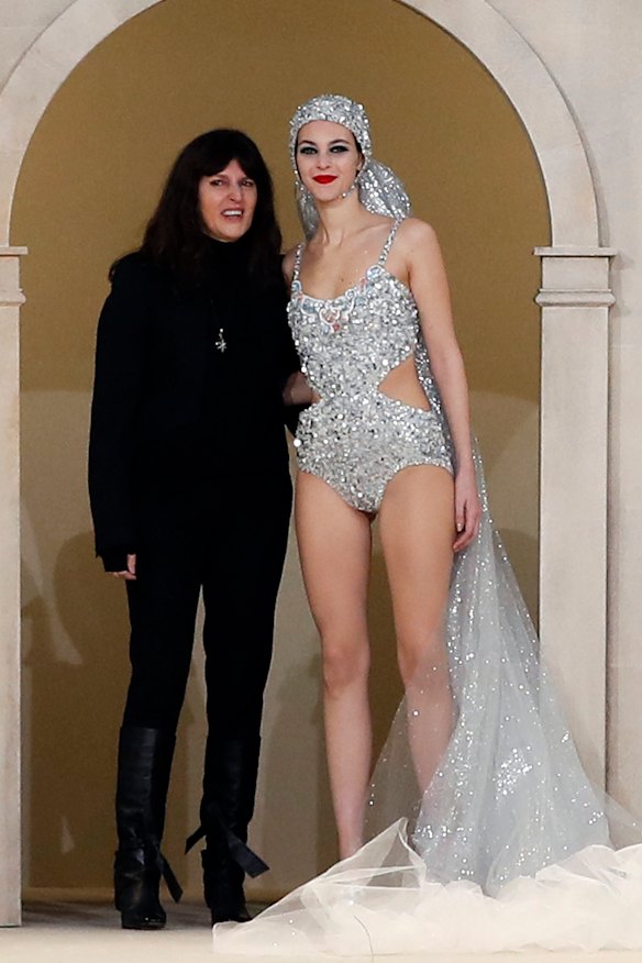 Virginie Viard, left, poses with a model during the Chanel Spring/Summer 2019 Haute Couture fashion collection presented in Paris, Tuesday January 22, 2019.