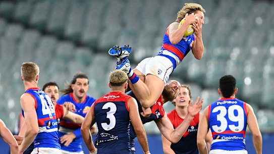 Cody Weightman soars over Max Gawn earlier this year.