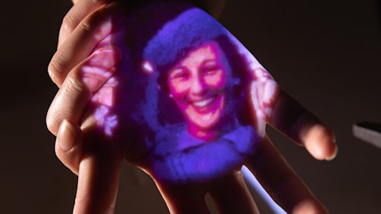 Home movies play out on a visitor’s hand in ACMI’s new Memory Garden.