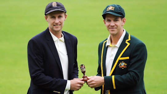 England captain Joe Root, left, and Australia’s captain Tim Paine pose with the Ashes urn before the first Test in 2019.