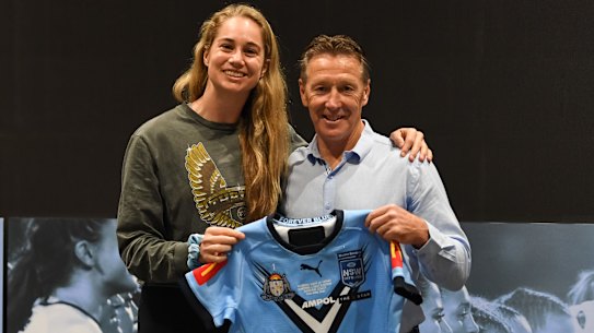 Craig Bellamy presents Blues captain Kezie Apps with her NSW jersey.