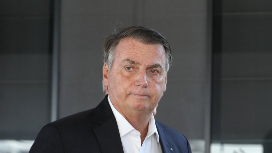 Former Brazilian president Jair Bolsonaro outside his home in Brasilia earlier this month after Federal Police agents carried out a search of it.