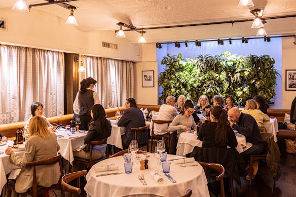 A vertical garden is a focal point of the dining room.