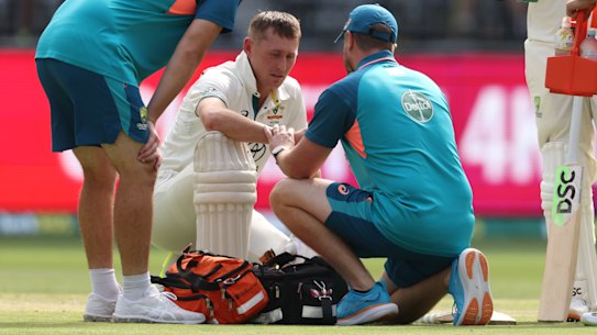 Marnus Labuschagne is treated for a hand injury he suffered on Saturday.