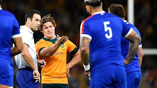 Michael Hooper and referee Ben O’Keeffe.