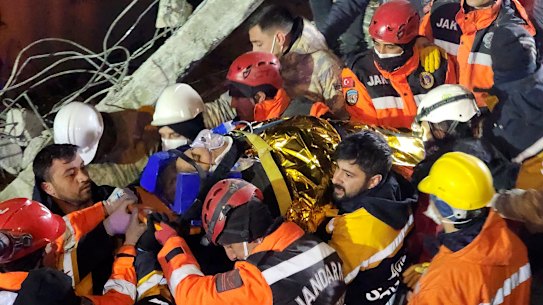 Rescue workers pull out Naime Sakar from a collapsed building in Adiyaman, southern Turkey, on Monday.