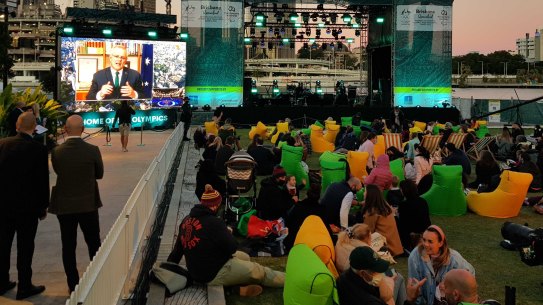 Crowds at South Bank, Brisbane, gather to hear the IOC’s decision.