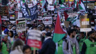 Protesters hold placards during a pro-Palestinian protest in London at the weekend. 