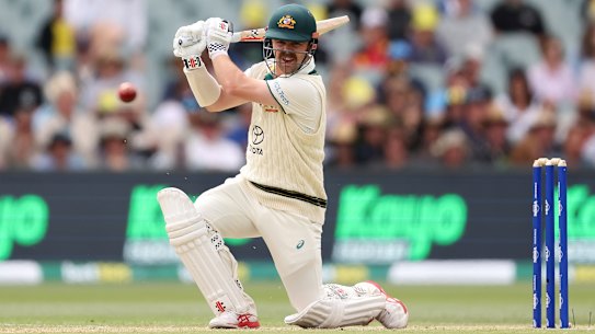 Travis Head carves a boundary on day two in Adelaide.