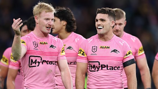 Nathan Cleary shares a joke with tryscorer Thomas Jenkins.