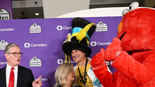 Labour leader Keir Starmer pays tribute to Nick the Incredible Flying Brick of the Monster Raving Loony Party (wearing the hat) and Bobby “Elmo” Smith (in the red costume).