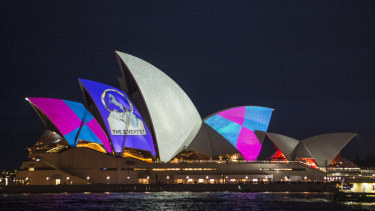 Protestors shine light onto the sails of the Opera House during the launch of the Everest barrier draw projection.