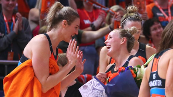 Kim Green (right) celebrates with Giants teammate Caitlin Bassett.