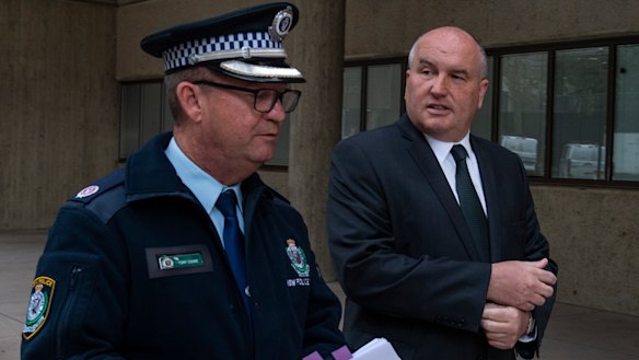 Police Minister David Elliott, pictured with Acting Assistant Police Commissioner Tony Cooke, renewed his warning for businesses and their patrons to comply with public health orders.