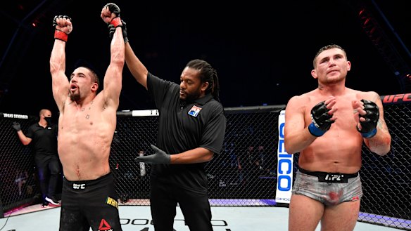 Australian UFC star Robert Whittaker celebrates after his win over Darren Till.