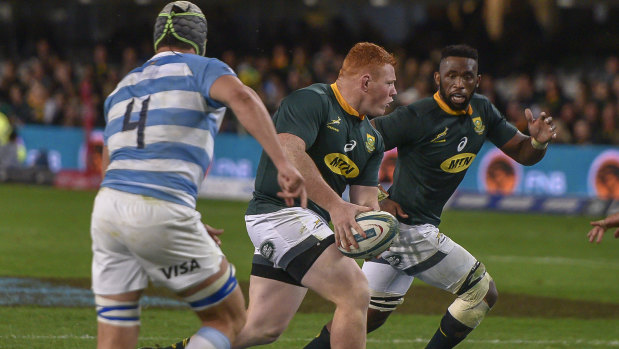 Work to do: South Africa loose-head prop Steven Kitshoff passes to Siya Kolisi in the victory over Argentina.