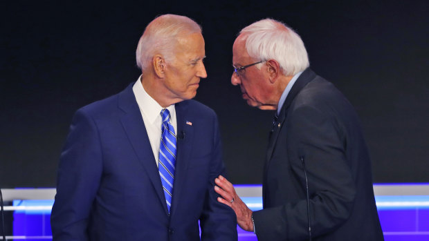 Democratic presidential candidates Senator Bernie Sanders and former vice-president Joe Biden during a break in the Democratic primary debate.