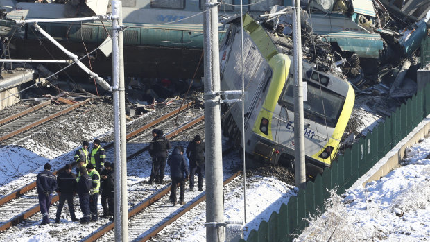 Rescue crews work at the scene of a train accident in Ankara, Turkey.