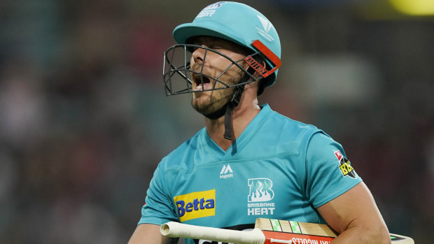 Chris Lynn of the Heat reacts as he walks off after being caught for 94 runs.