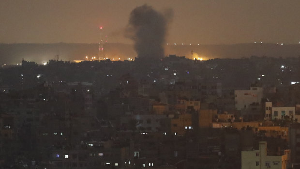 An explosion caused by Israeli air strikes in Gaza City early on Thursday.