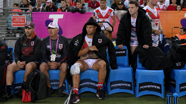 Big loss: Tariq Sims sits on the bench after injuring his knee.