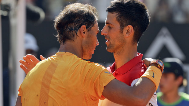 Spain's Rafael Nadal, left, hugs Serbia's Novak Djokovic at the end of their semifinal.