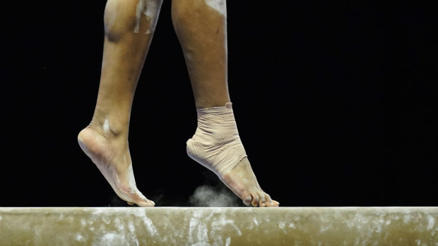 A gymnast trains.